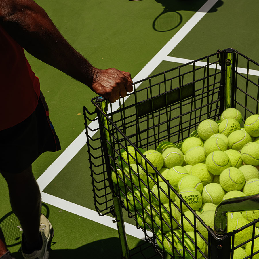 Untitled-1 tennis balla in basket on the court